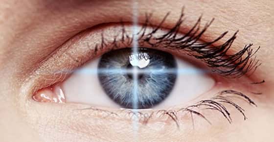 Image of an eye in laser cross hairs.