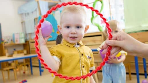 child looking through red circle