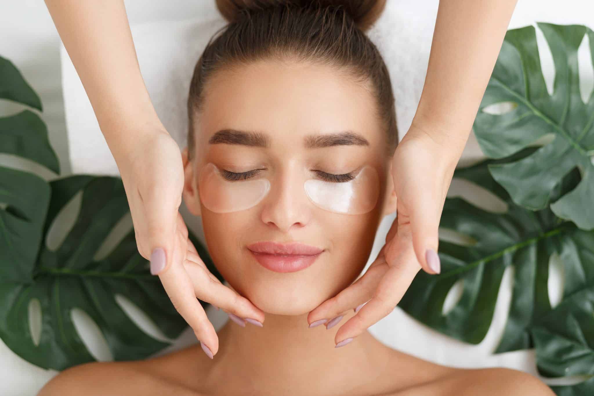 Woman enjoying a soothing medical facial with eye patches, made for sensitive skin and dry eye relief in Provo.